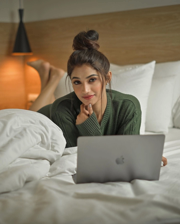 Reeshma Nanaiah working on her laptop