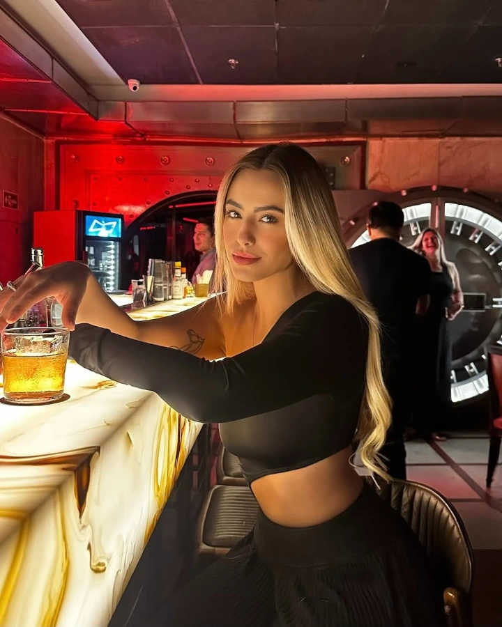 Mariana Tollendal Drinking Wine